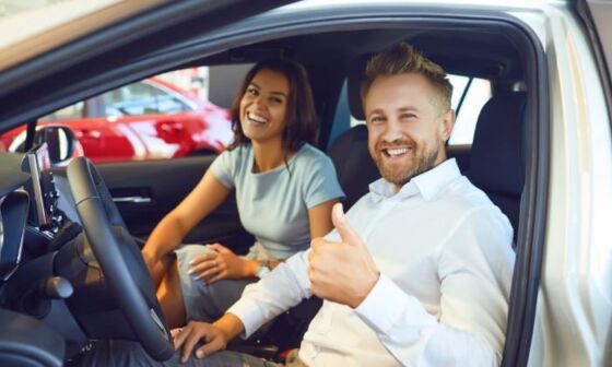 Couple enjoying renting a car