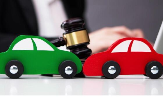 Collided cars in front of the court gavel