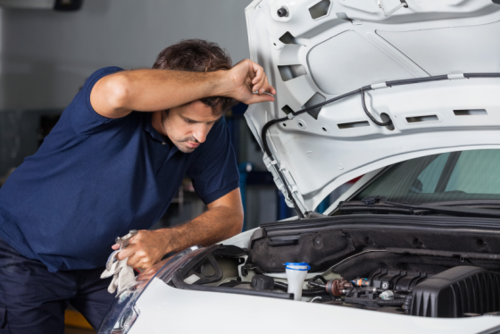 How the EGR valve works - a man looking under the hood of a car